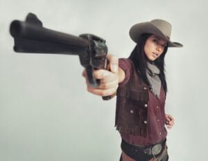 Im the sheriff around these parts...Full-length shot of an attractive young woman in cowboy attire.