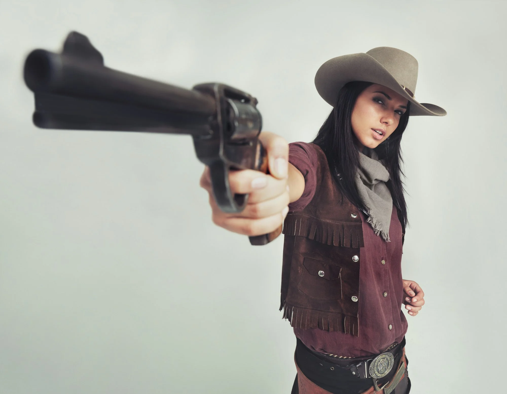 Im the sheriff around these parts...Full-length shot of an attractive young woman in cowboy attire.